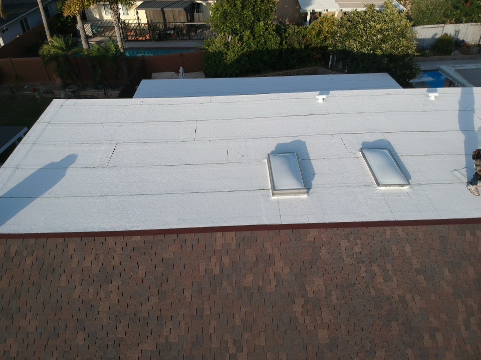 Low-slope roof with skylights